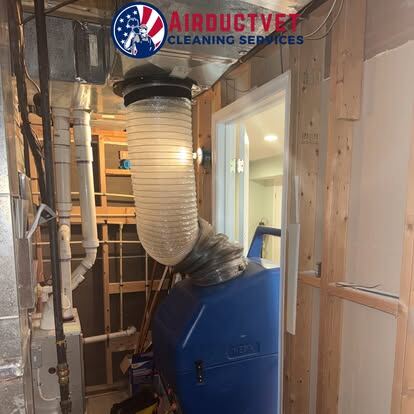 air duct cleaning equipment: AirDuctVet negative-air equipment operating on a commercial project