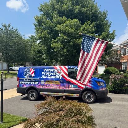 airductvet credentials and service standards: a patriotic AirDuctVet service van at a completed local stop