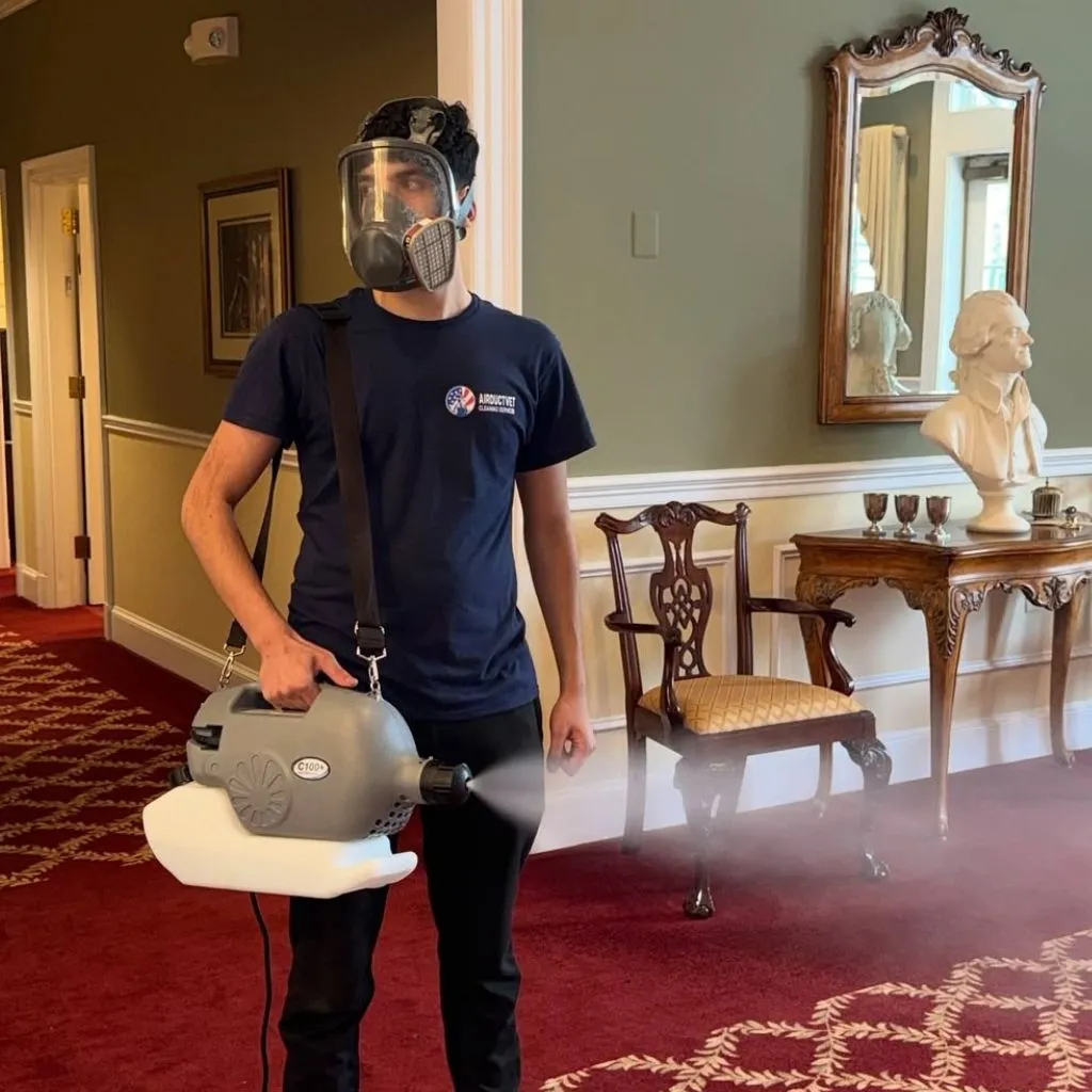Technician using ULV fogger for duct sanitizing in Alexandria VA