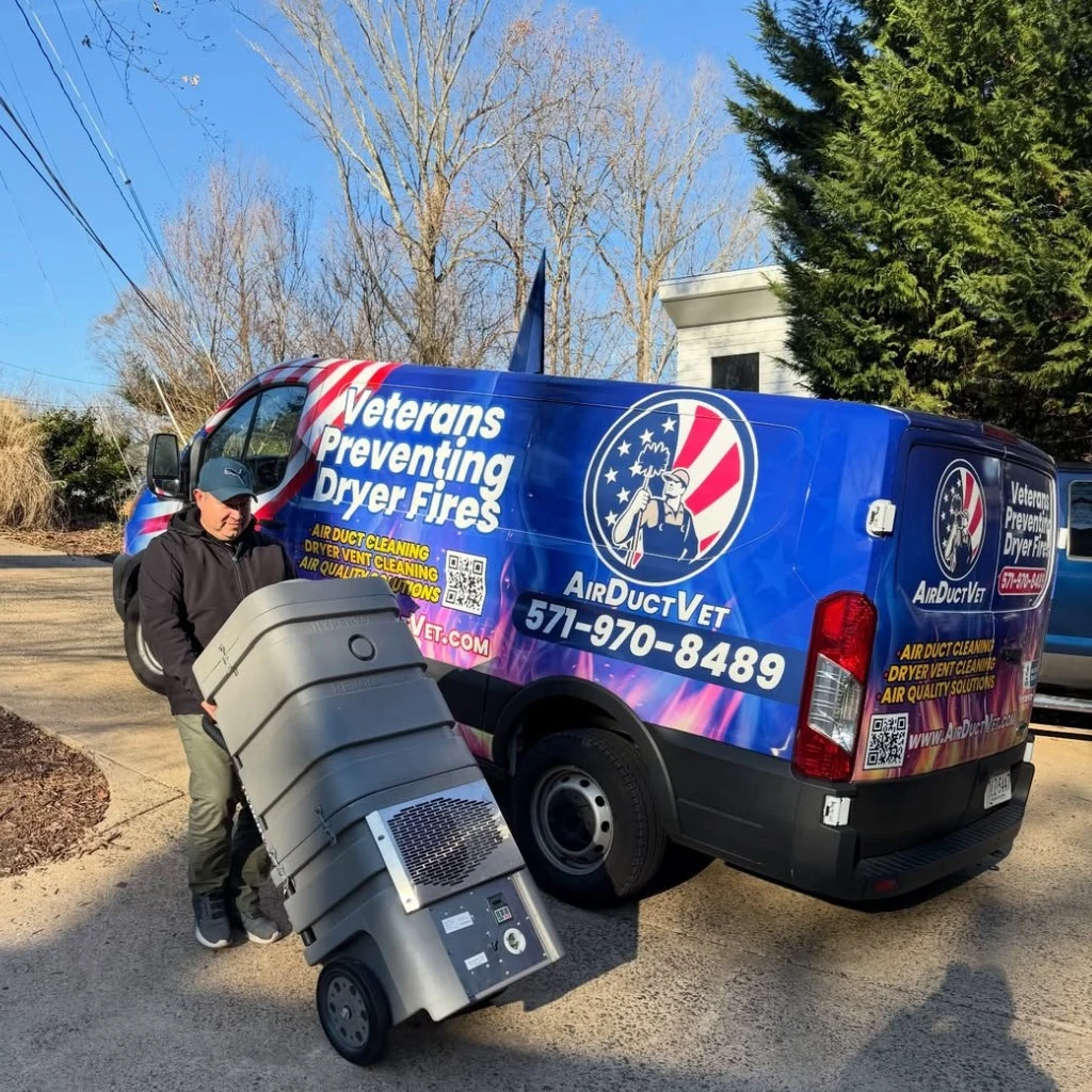 Air Duct Vet technician deploying heavy-duty filtration equipment to eliminate the health risks of dirty vents in Alexandria.