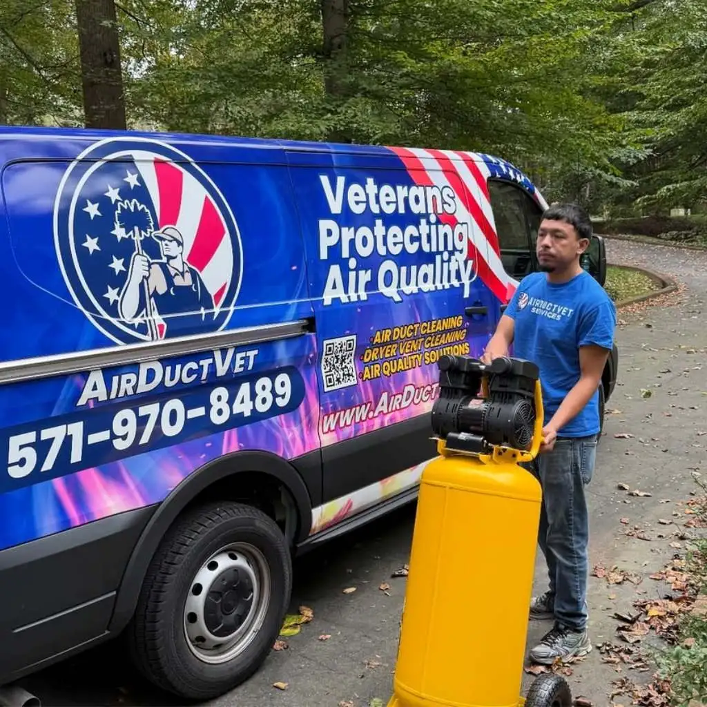 Technician with a yellow air compressor and branded van arriving to provide clean vents and sleep quality solutions.