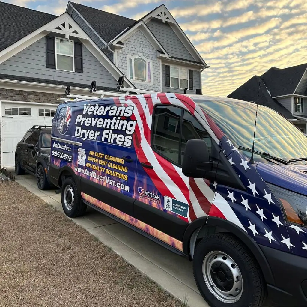 Air Duct Vet van parked in a residential driveway, arriving to resolve the mold dust lint health threat for a suburban family.