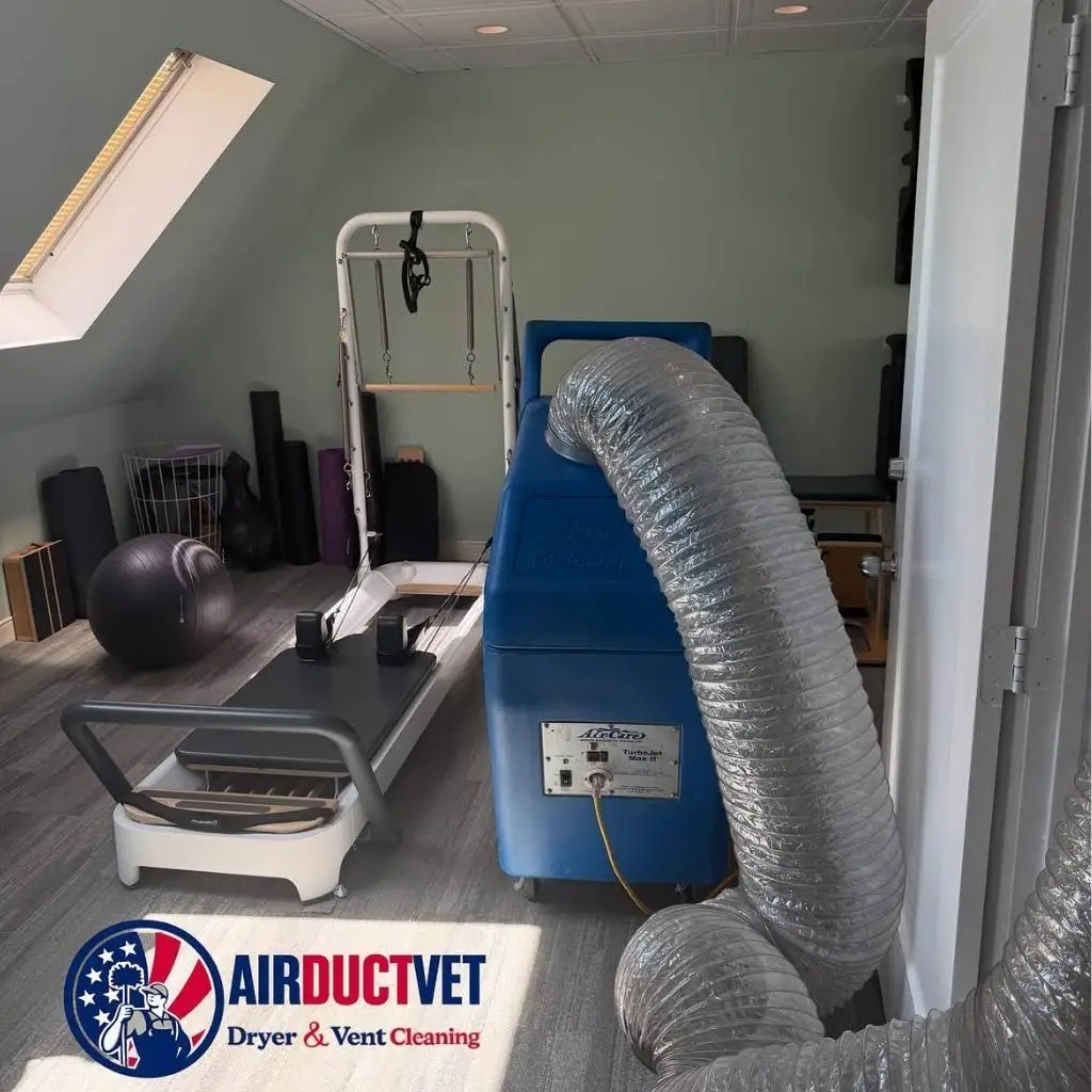 AirDuctVet air duct cleaning equipment with flexible hose set up in a home gym for Raleigh Durham Triangle duct cleaning service