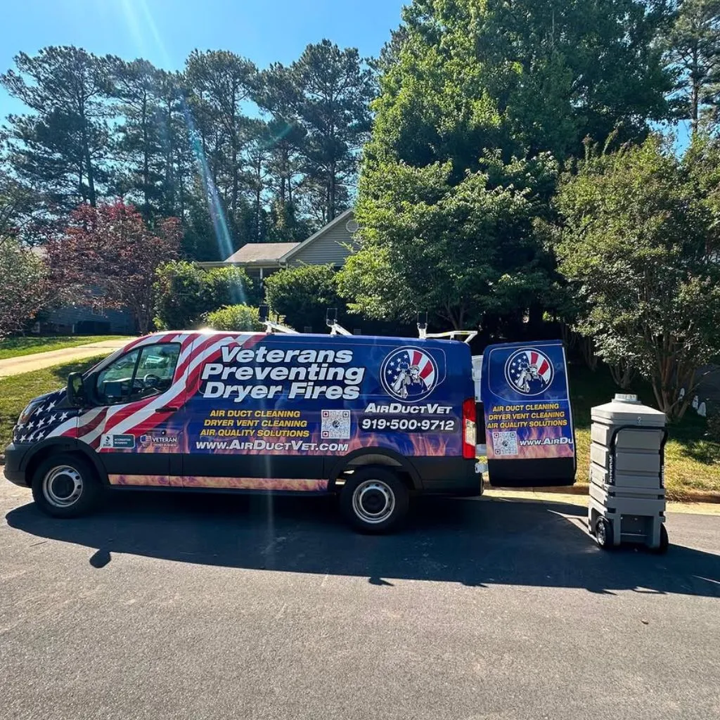 AirDuctVet branded service van parked on a residential street with equipment staged, ready for dryer vent cleaning Cary NC service